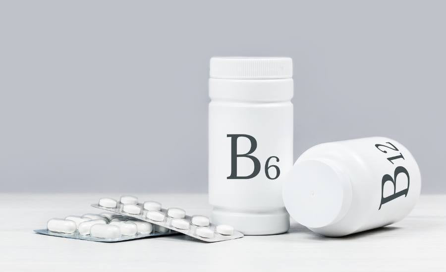 photo réaliste pot de gélules blanches avec marqué B6 dessus