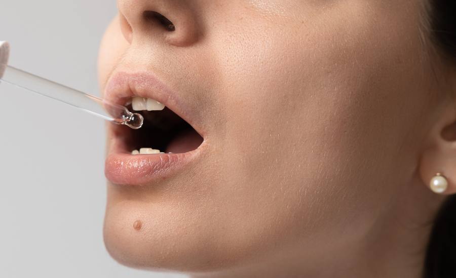 metti qualche goccia di olio CBD sotto la lingua per la massima efficacia